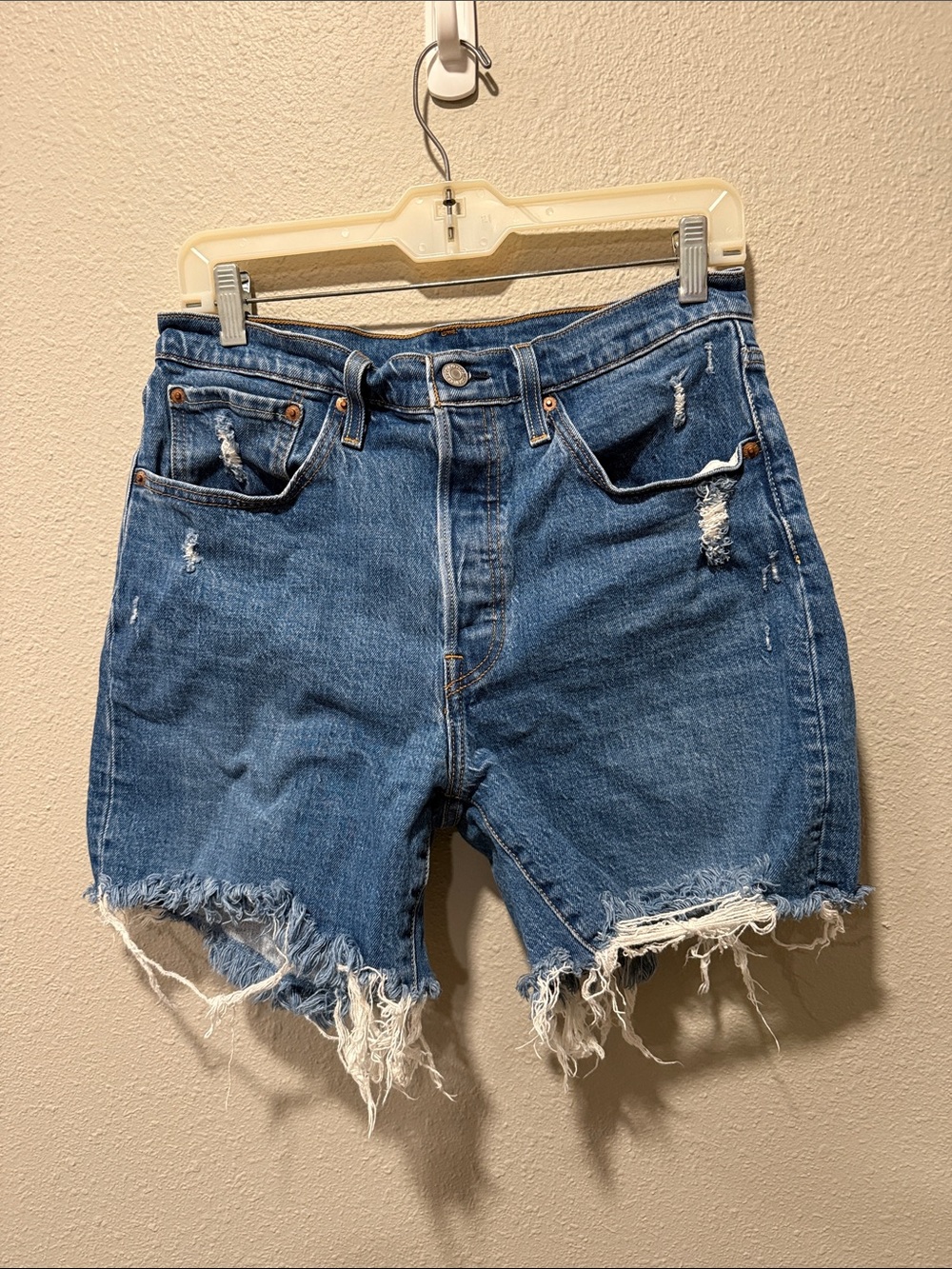 Levi's Distressed Raw Hem Blue Denim Shorts